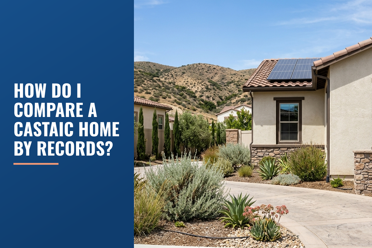A stucco suburban house in Castaic, California with drought-tolerant landscaping, solar panels on the roof, and dry foothills in the background.