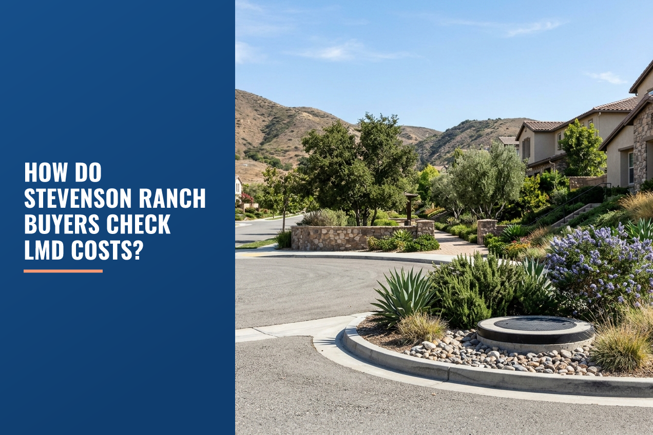A quiet residential street in Stevenson Ranch, California, featuring drought-tolerant landscaping, a stone retaining wall, and foothills.