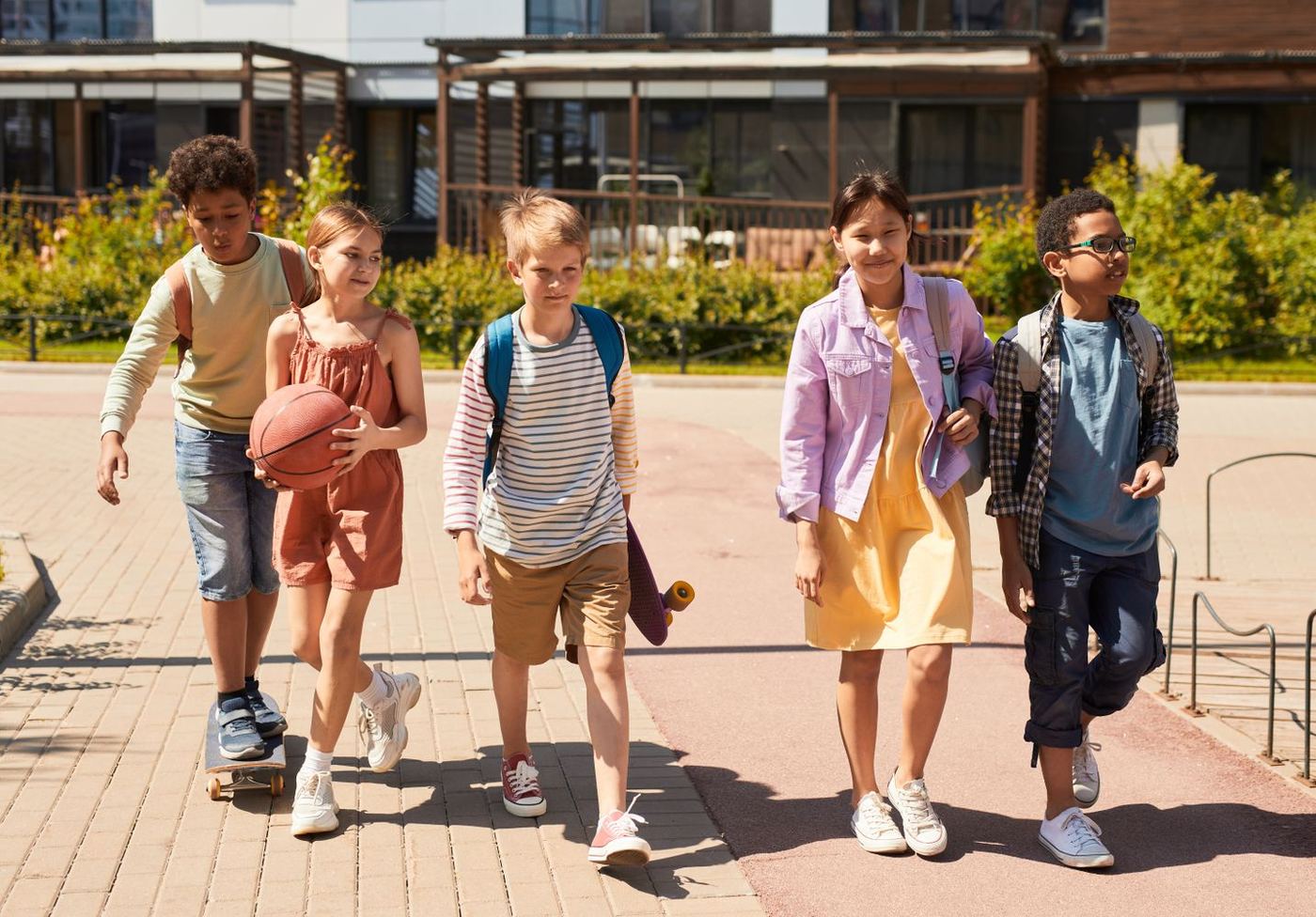 Kids walking together with backpacks on the first week of the school year in Stevenson Ranch, Santa Clarita