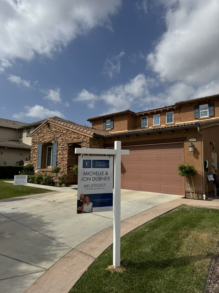 Dubner Real Estate Group sign in front of a home
